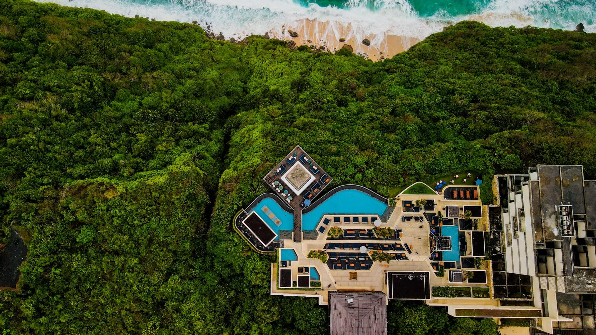 Luxury resort nestled along a calm tropical shoreline